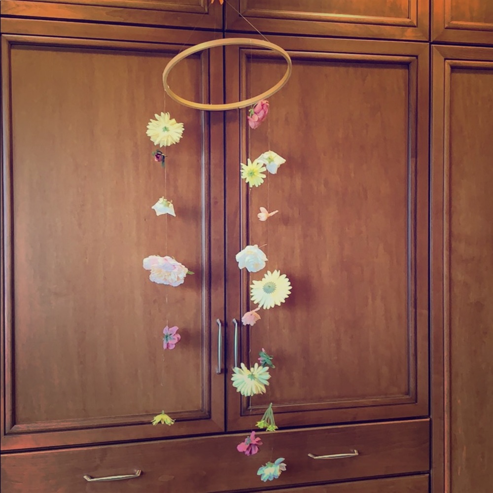 Floating delicate wood and flower mobile